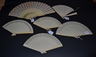 Lot 5085 - A Quantity of Celluloid Brisé Fans, the first in cream with pink and yellow roses painted in a...