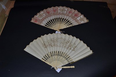 Lot 5090 - A Mid-19th Century Fan with lithographed leaf, the central scene featuring a village dance, the...