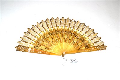 Lot 5112 - A Good Early 19th Century Gothic Pale Horn Brisé Fan, carved, pierced and gilded, the tips...