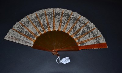 Lot 5129 - A Late 19th Century Brussels Lace Fan, the Point de Gaze needle lace leaf mounted on resin or...