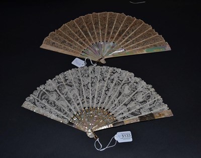 Lot 5133 - An Early 20th Century Mother-of-Pearl Fan with an embroidered net leaf, most likely Limerick...