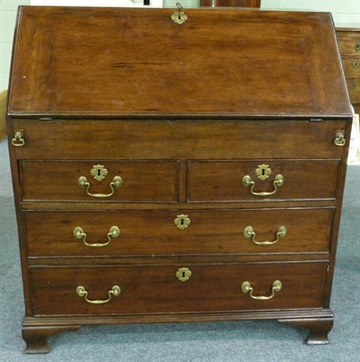 Lot 1295 - An Oak Bureau, 18th century and later, the fall enclosing an attractive fitted interior of...