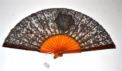 Lot 5135 - An Attractive Floral Black Lace Fan, most likely Chantilly, circa 1900, the leaf incorporating...