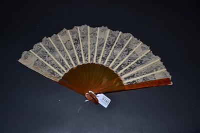 Lot 5140 - An Attractive Late 19th Century Brussels Point De Gaze Needle Lace Fan, the lace leaf mounted...