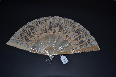 Lot 5144 - A Late 19th Century Pink Mother-of-Pearl Fan, the monture unadorned, the needle lace leaf of...