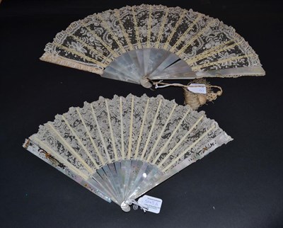 Lot 5145 - A Late 19th Century White Mother-of-Pearl Fan with bone ribs, the leaf of Brussels Bobbin...