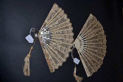 Lot 5147 - Two Early 20th Century Lace Fans, the first of plain pink mother-of-pearl, bone ribs supporting...