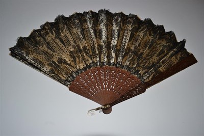 Lot 5154 - A Late 19th Century Brussels Bobbin Lace Fan, the leaf mounted on white mother-of-pearl, the design
