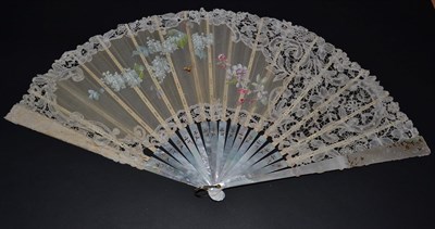 Lot 5155 - A Large Brussels Bobbin Lace Fan, the lace enclosing a white gauze panel painted with lilac,...