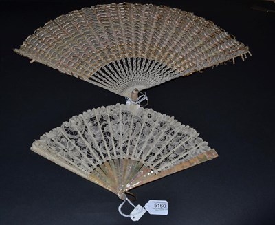 Lot 5160 - Two Late 19th/Early 20th Century Fans, the first a small pink mother-of-pearl example, a...