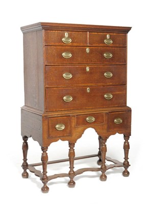 Lot 1298 - A Queen Anne Style Oak Chest on Stand, the ovolo moulded top above two short and three long...