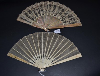 Lot 5170 - An Early 20th Century Brussels Point De Gaze Needle Lace Fan, mounted on pink mother-of-pearl,...