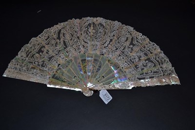 Lot 5172 - A Late 19th Century Lace Fan, the intricate monture of light pink mother-of-pearl, carved and...