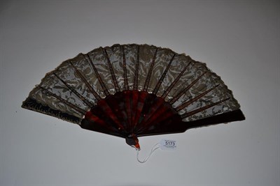 Lot 5173 - An Art Nouveau Lace Fan with a design of Iris. Mounted on plain tortoiseshell, with...
