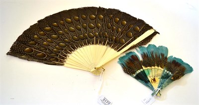 Lot 5177 - An Early 20th Century Celluloid Fan, the central sticks plain cream, the remaining sticks in a...