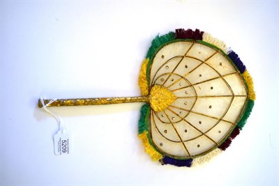 Lot 5209 - Mica Fan, India, a fixed fan or face screen, the bamboo handle gilded. The paddle-shaped screen...