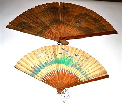 Lot 5210 - Japan, 19th Century, A Large Wood Brisé Fan painted to the recto with a distant view of Mount...