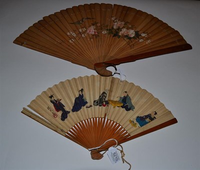 Lot 5210 - Japan, 19th Century, A Large Wood Brisé Fan painted to the recto with a distant view of Mount...