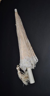 Lot 5247 - A Turn of the 20th Century Brussels Tape Lace Parasol, the large net cover beautifully...