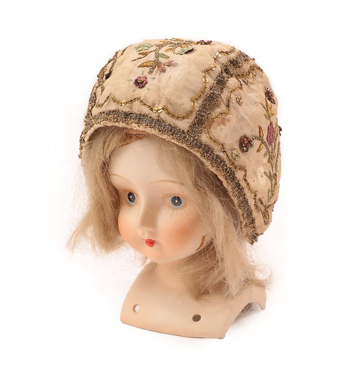 Lot 5270 - An Exquisite, Tiny 18th Century (or Early 19th Century) Child's Cap of cream silk, worked in...