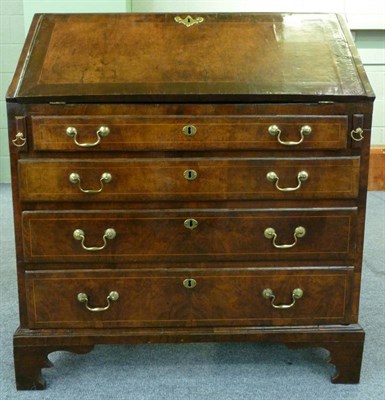 Lot 1309 - A George II Walnut and Boxwood Strung Bureau, early 18th century, the hinged slope inset with a...