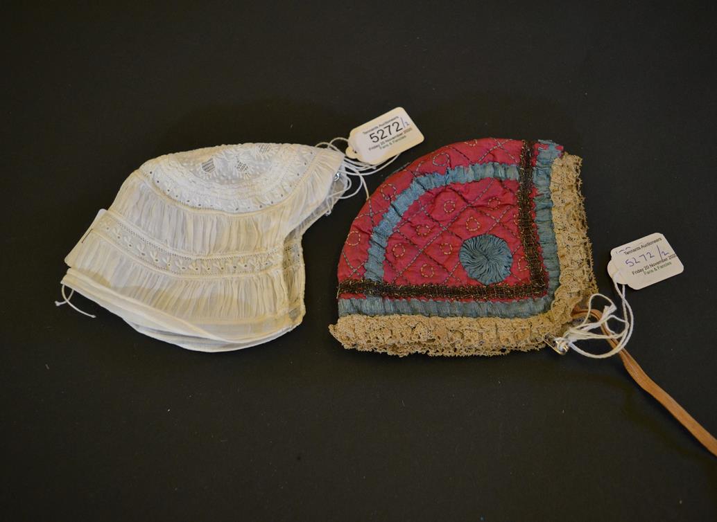 Lot 5272 - A 19th Century Quilted Silk Child's Cap, the background of cerise, with turquoise silk ribbon...