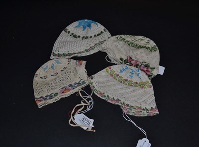 Lot 5278 - Four Knitted and Glass Beaded 19th Century European Bonnets or Caps in various designs and...