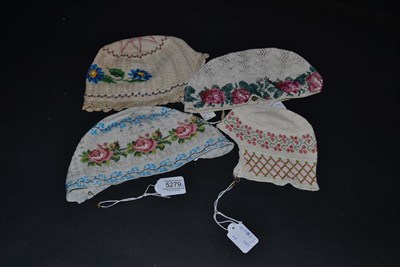 Lot 5279 - Four Knitted and Glass Beaded 19th Century European Bonnets or Caps in very different designs...