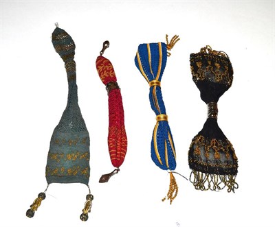 Lot 5301 - Four Medium Size 19th Century Miser's or Stocking Purses, one quite vibrant in black with gold...