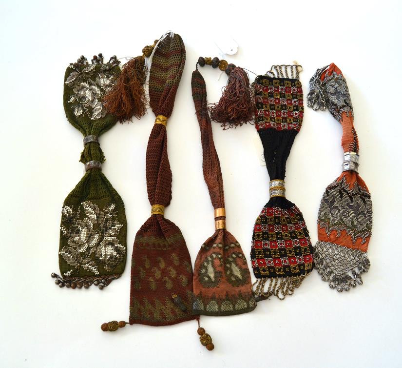 Lot 5302 - Five Purse Examples, to include three heavily beaded miser's or stocking purses, the first with...