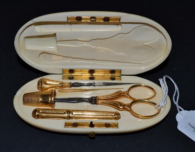 Lot 5325 - A Gilt Metal Sewing Set, French marks with maker's mark 'AOB'  late 19th century, presented in...