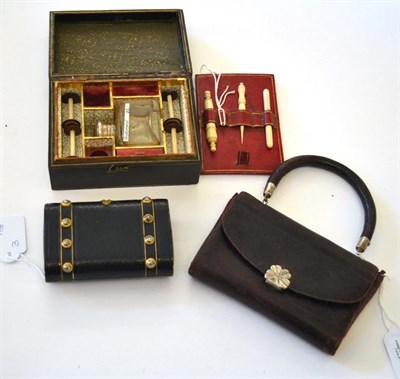 Lot 5333 - Three 19th Century Leather Covered Sewing Sets, the first of handbag form with rigid handle,...