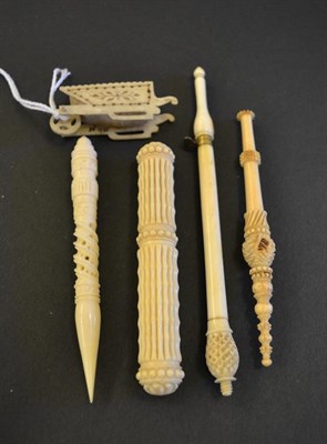 Lot 5340 - Five Various Sewing Tools. Comprising a carved ivory needle case, the pointed end no doubt also...