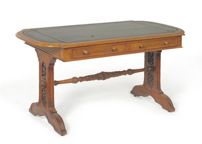 Lot 1317 - A Victorian Walnut Writing Table, mid 19th century, the rounded rectangular top with inset...