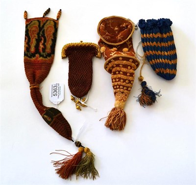 Lot 5363 - Four 19th Century Purses of different forms, comprising a reticule worked in ginger with pale...