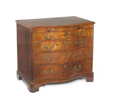 Lot 1320 - A George III Mahogany Serpentine Fronted Chest, circa 1800, the crossbanded top above a pullout...