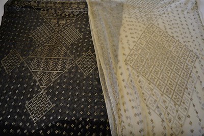 Lot 5381 - Two Art Deco Azute or Assyut Shawls, from circa 1925: the first, in black cotton, with silver metal