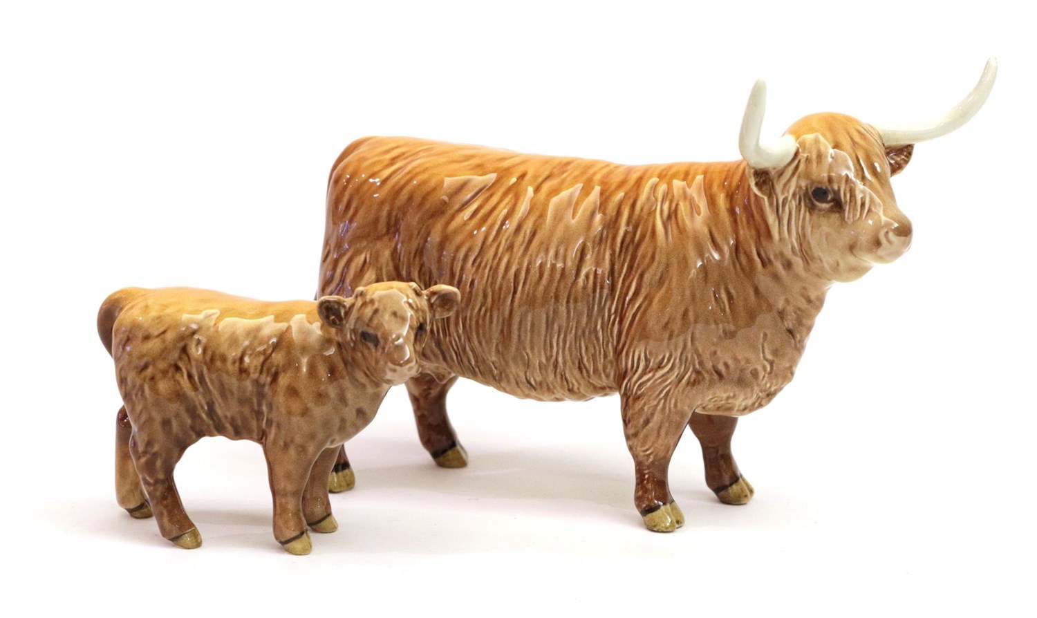 Lot 26 - Beswick Highland Cow, model No. 1740 and Highland Calf, model No. 1827D, both tan and brown...