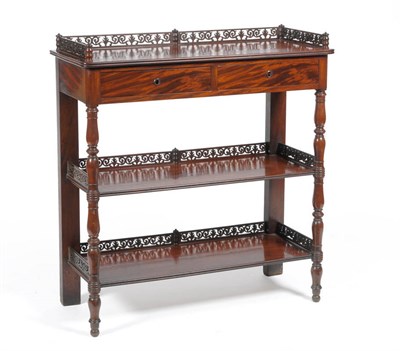 Lot 1324 - A Mahogany Three Tier Buffet, mid 19th century, the pierced three-quarter gallery above two...