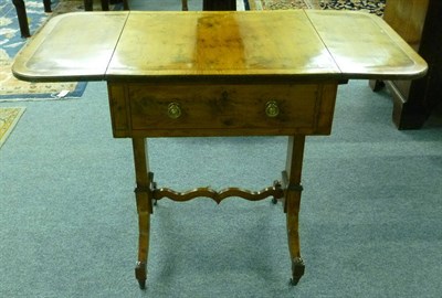 Lot 1355 - A George IV Yewwood Twin-Flap Sewing or Work Table, with narrow dentil stringing single drawer,...