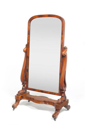 Lot 1357 - A Victorian Mahogany Cheval Mirror, the arched plate with pierced scroll uprights, on knurled...