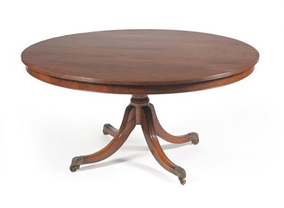 Lot 1358 - A George III Mahogany Circular Dining Table, early 19th century, with reeded edge and plain frieze