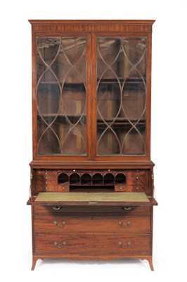 Lot 1366 - A George III Mahogany Secretaire Bookcase, circa 1800, the plain frieze above a pair of glazed...