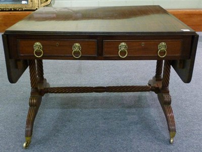 Lot 1367 - A Mahogany Sofa Table, 19th century with alterations, the rectangular top with reeded edge and...