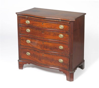 Lot 1370 - A George III Style Mahogany Crossbanded Serpentine Front Chest,, with pull-out brushing slide above