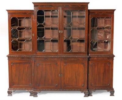 Lot 1374 - A Chippendale Style Mahogany Breakfront Bookcase, early 19th century, the relief carved frieze...