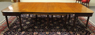 Lot 1383 - A George III Mahogany D End Dining Table, early 19th century, the two rounded rectangular  end...