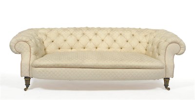 Lot 1397 - A Late Victorian Chesterfield Settee, upholstered in modern cream button back fabric, the...