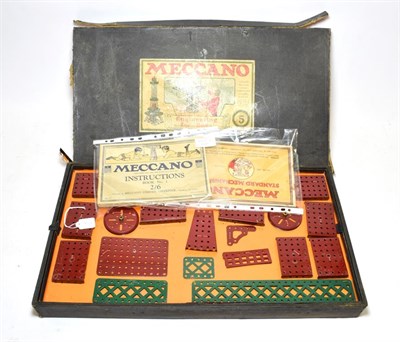 Lot 3469 - Meccano Engineering For Boys Outfit No.5 red/green parts strung onto original card inserts,...