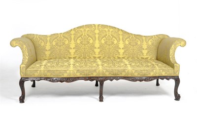 Lot 1407 - A Fine George III Style Carved Mahogany Sofa, probably 19th Century, upholstered in green silk...